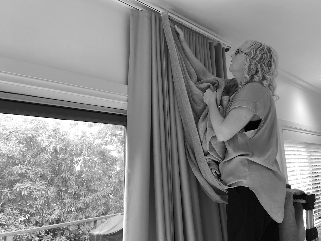 Curtains being installed